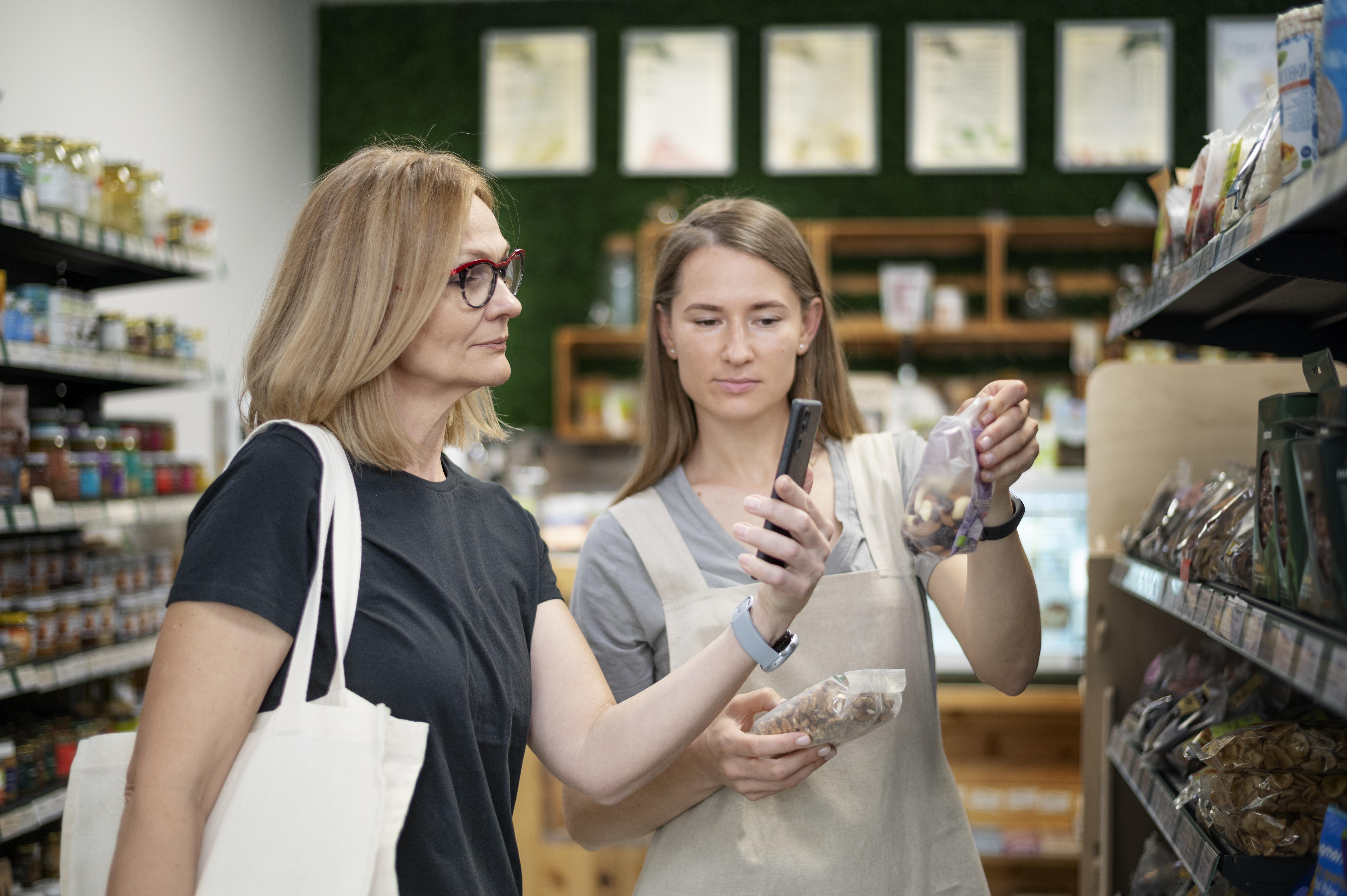 Shopper checking product on phone