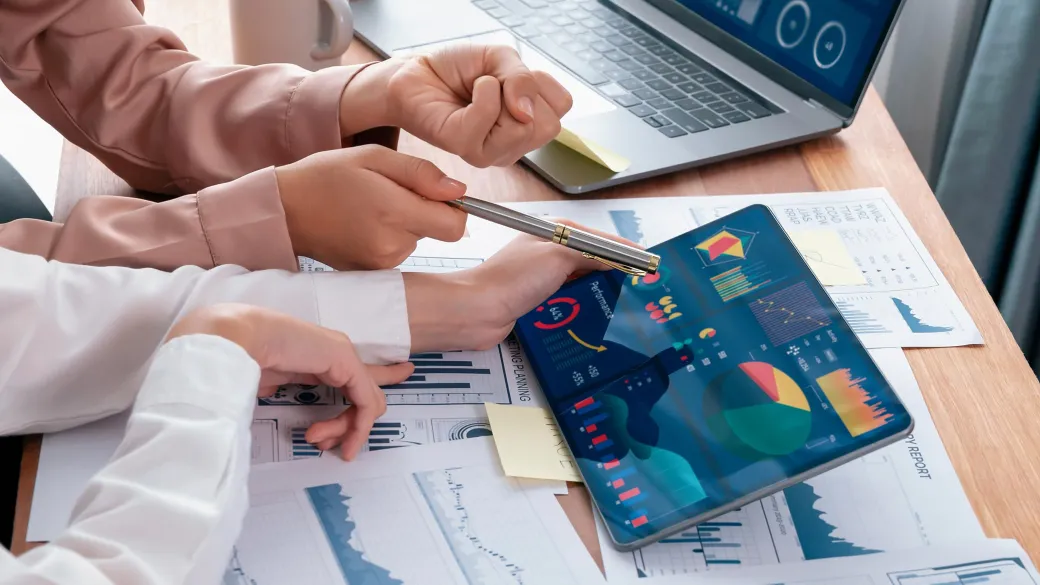 Colleagues analyzing business charts