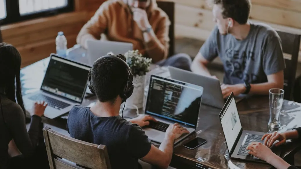 detail hosted checkout people at laptops