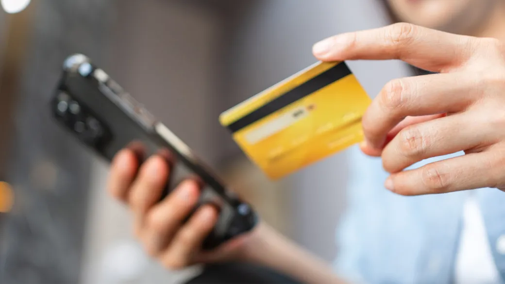 environmental-acquiring-services-woman-holding-credit-card