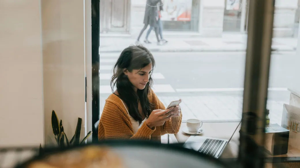people cloud services young woman using smartphone cafe
