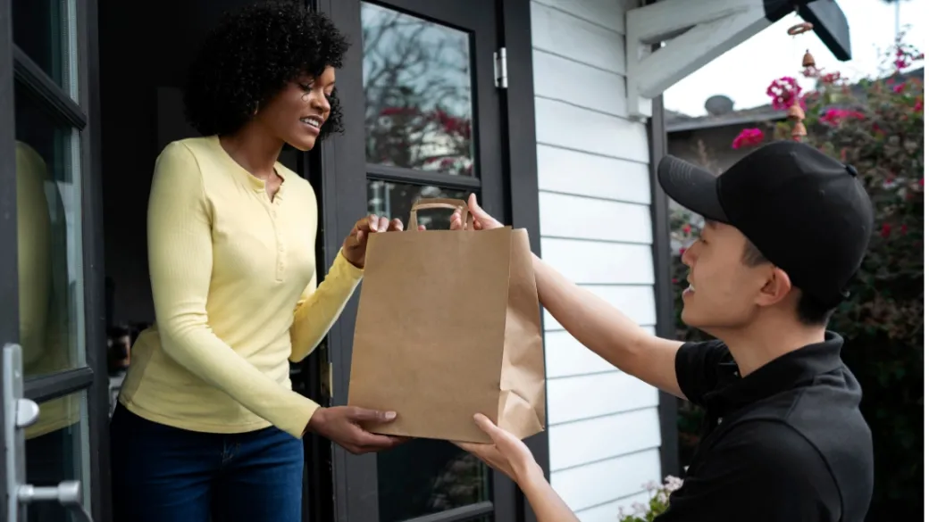 people convenience retail condelivery person getting parcel