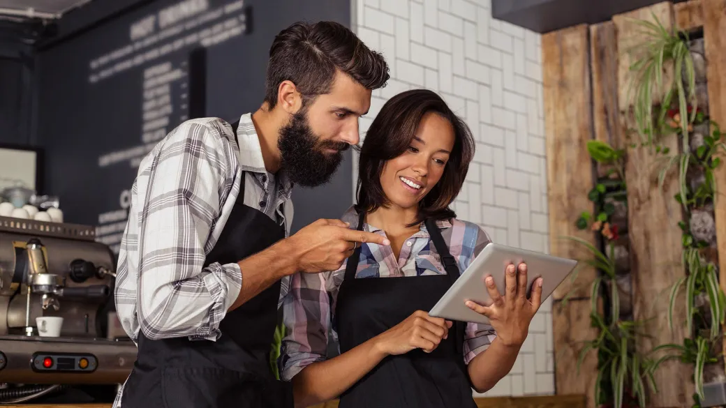 Cafe owners using tablet