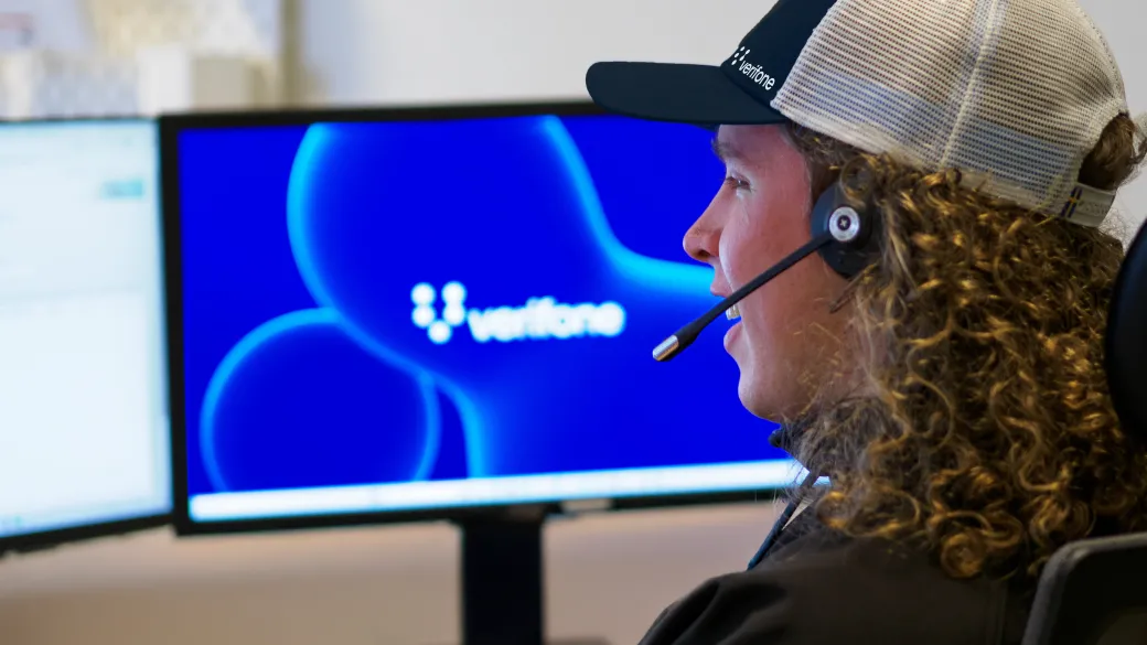 Customer support representative talking on the phone with a customer