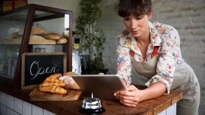 Bakery owner using tablet