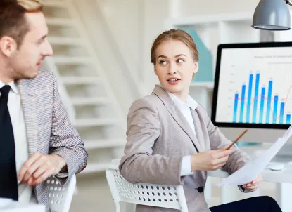 Young woman asking questions to a colleague