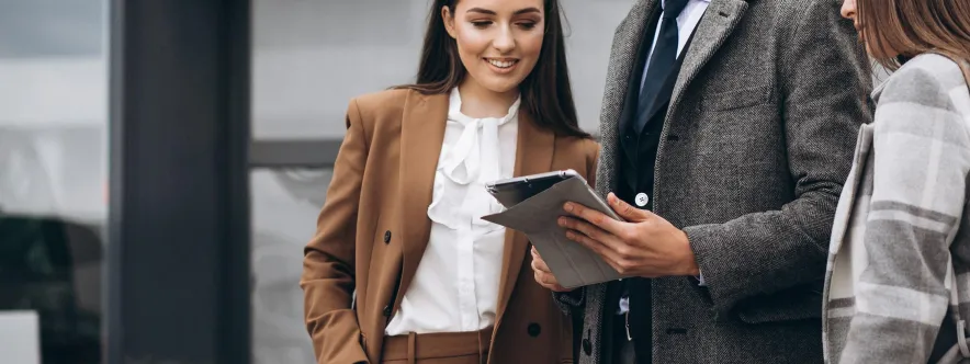 Business partners analyzing payment data on tablet