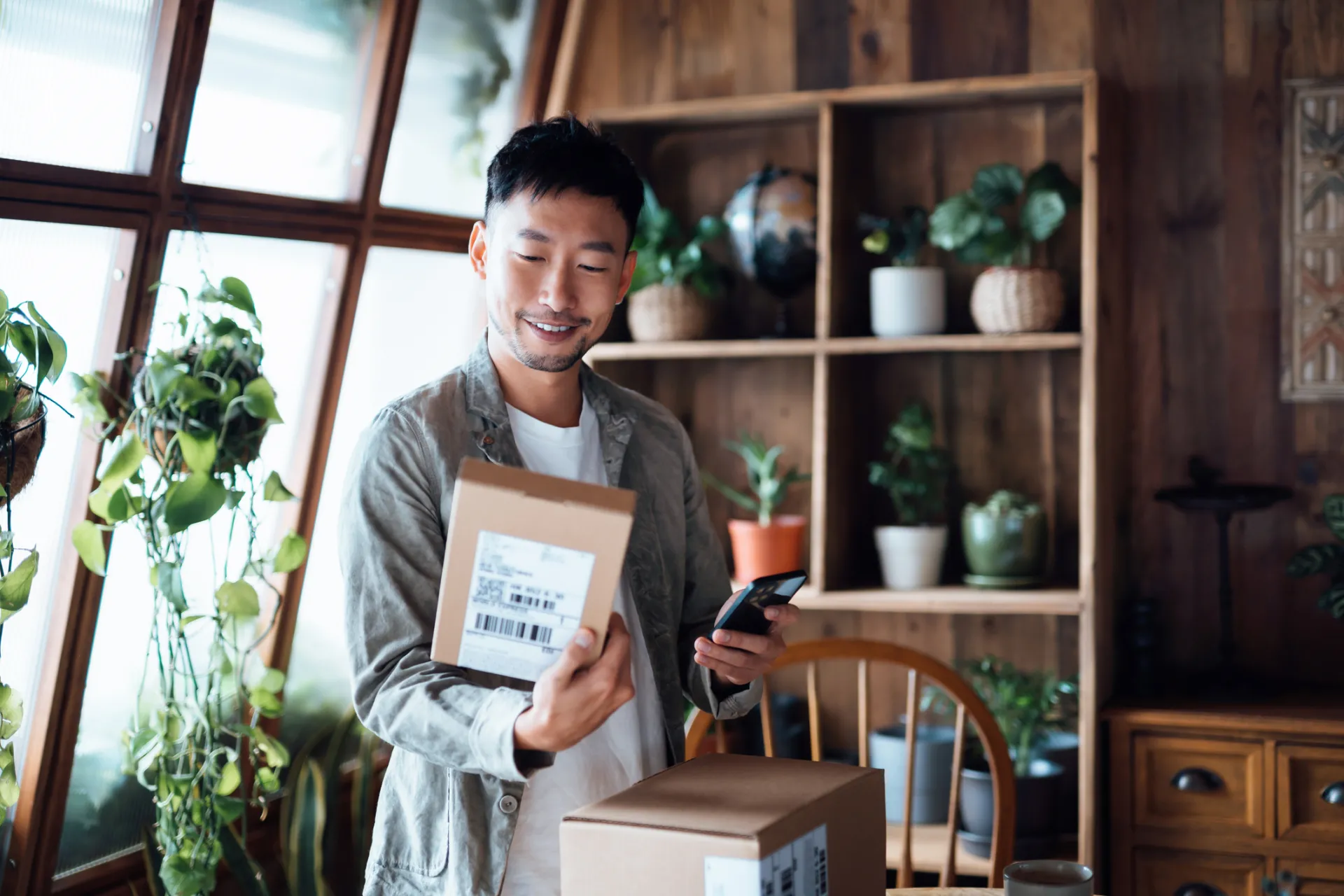 Asian Man with packages delivered in-home