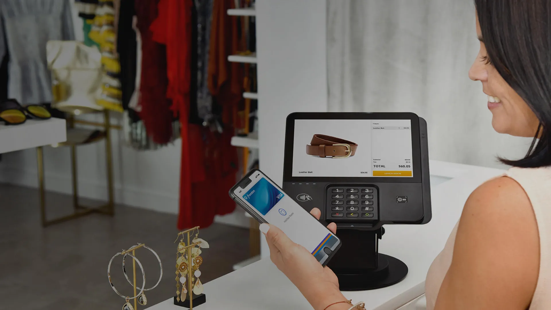 Young woman paying with mobile wallet