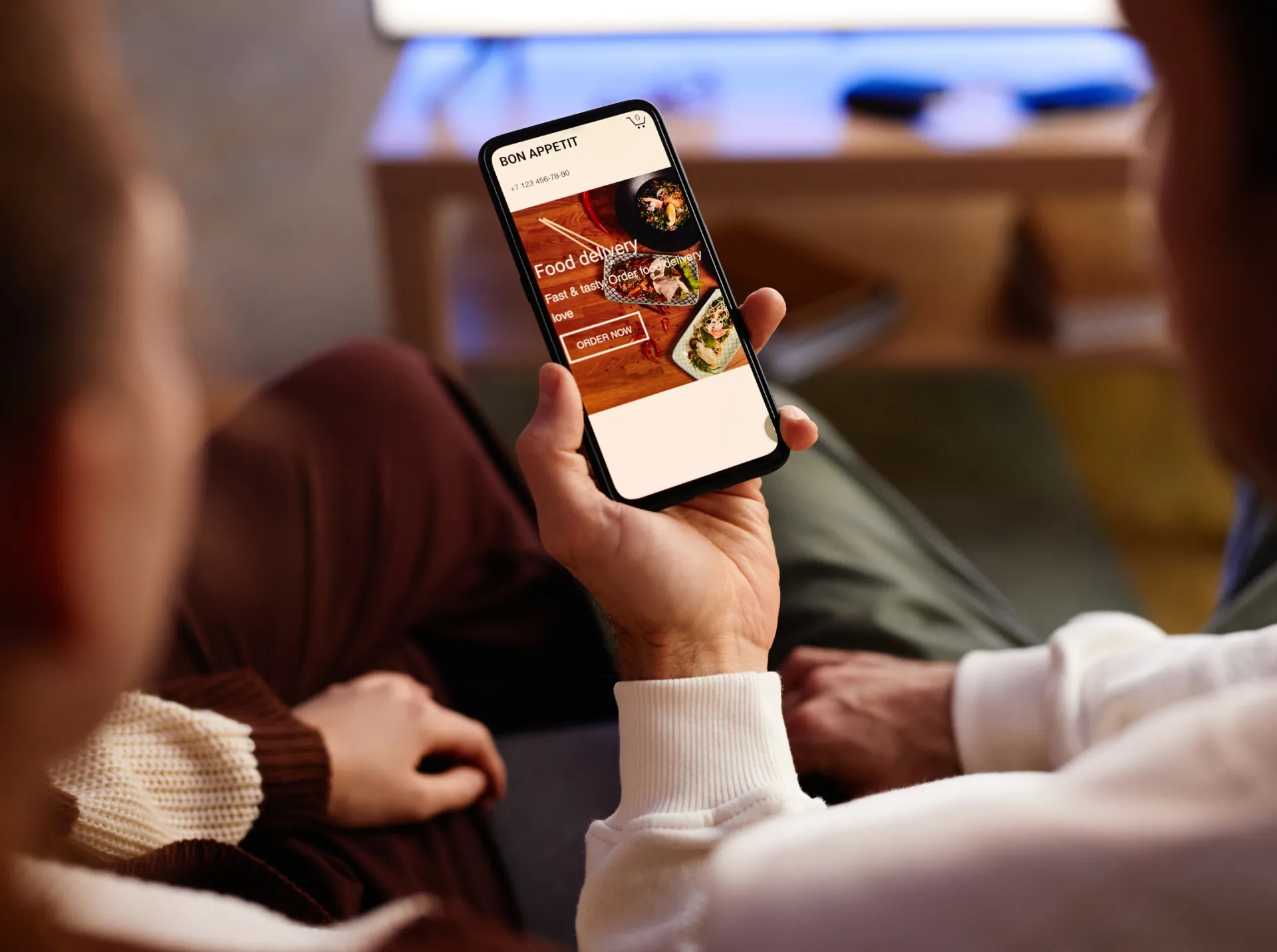 detail online ordering closeup woman using her mobile phone