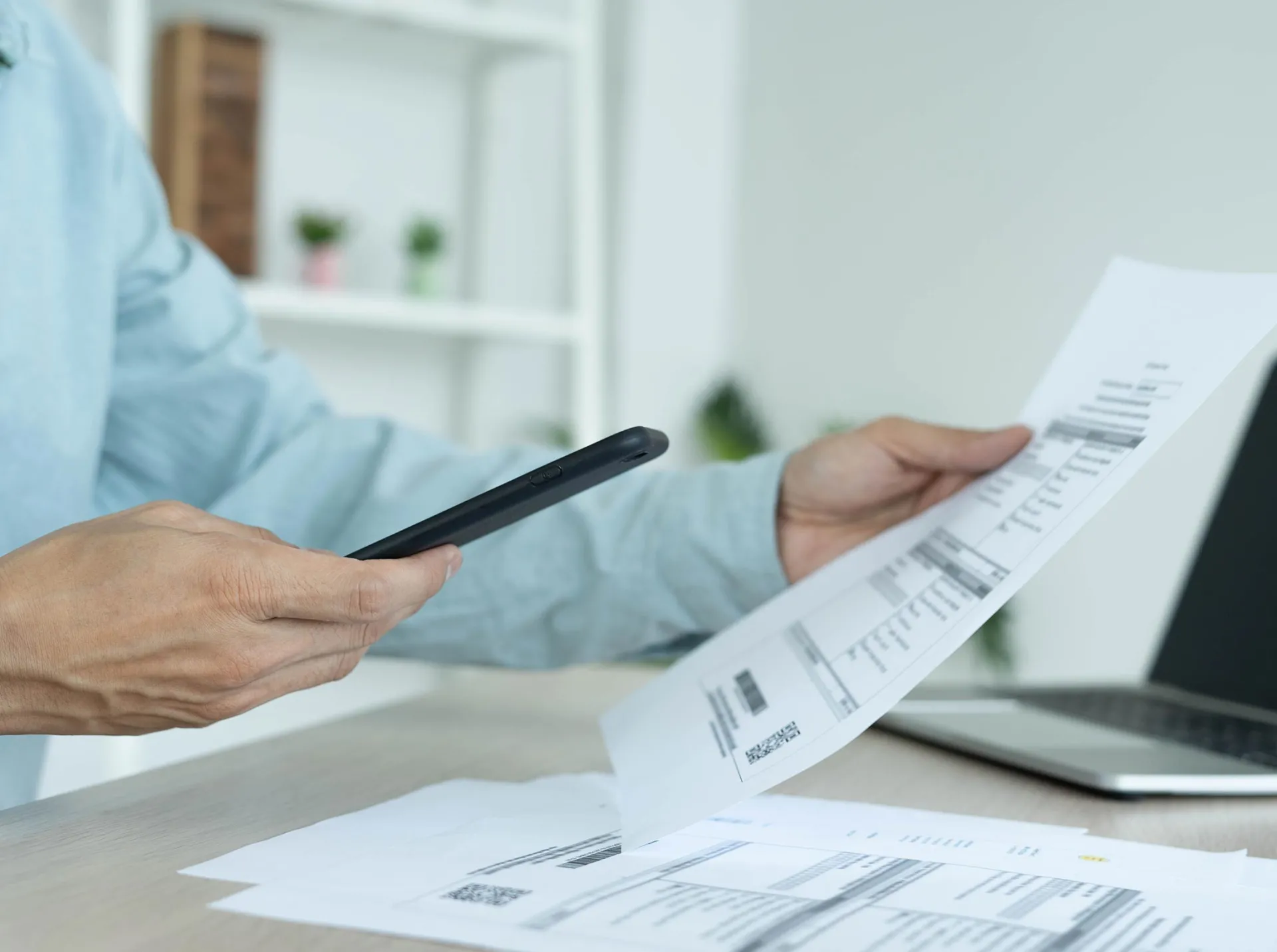 Man paying bills on mobile