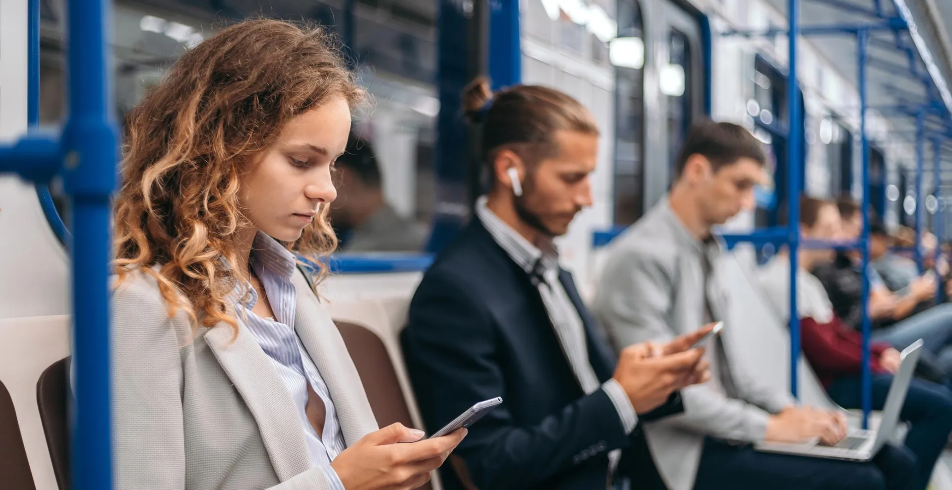 People reading news on the subway
