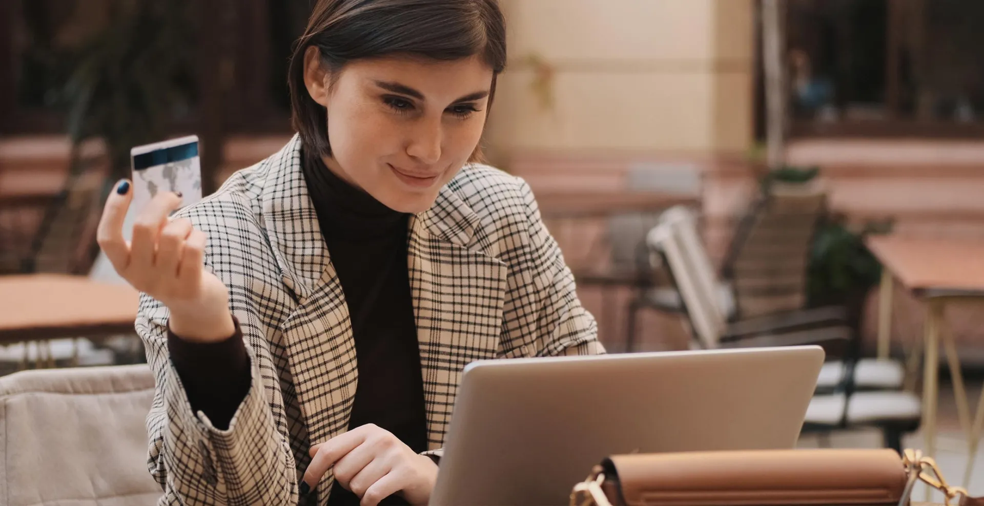 Woman paying online at terrace