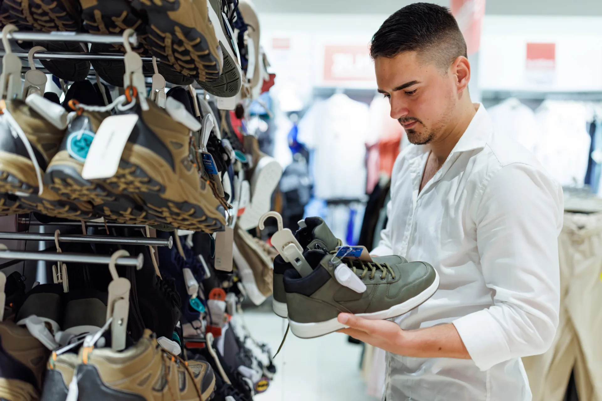 man shopping for athletic shoes
