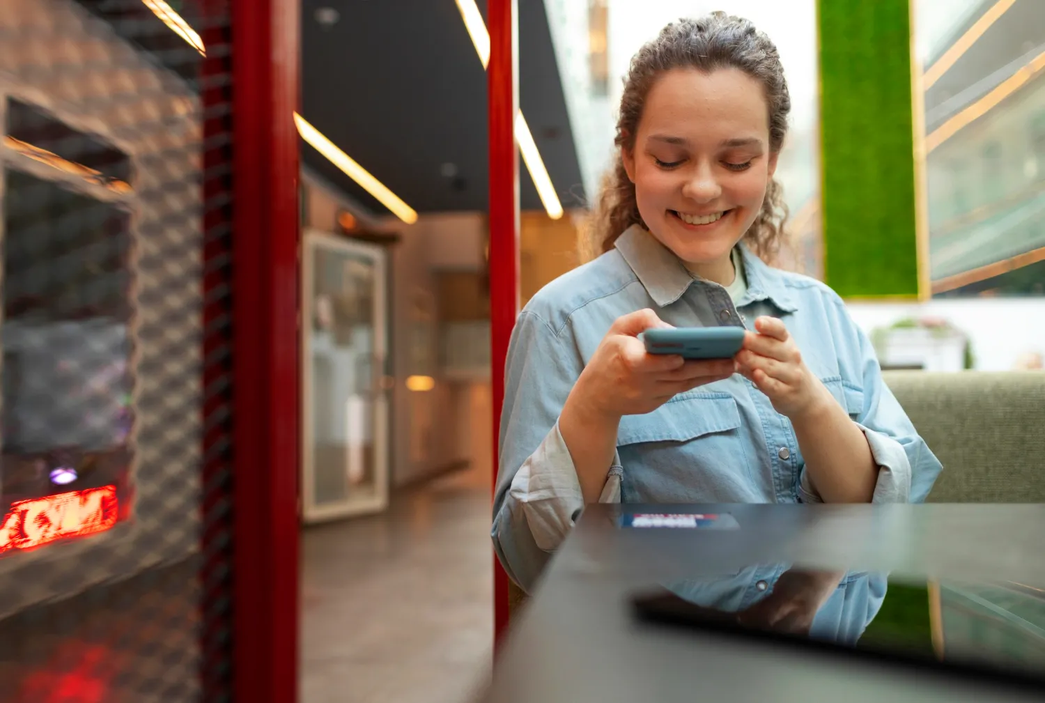 Woman scanning code at cafe