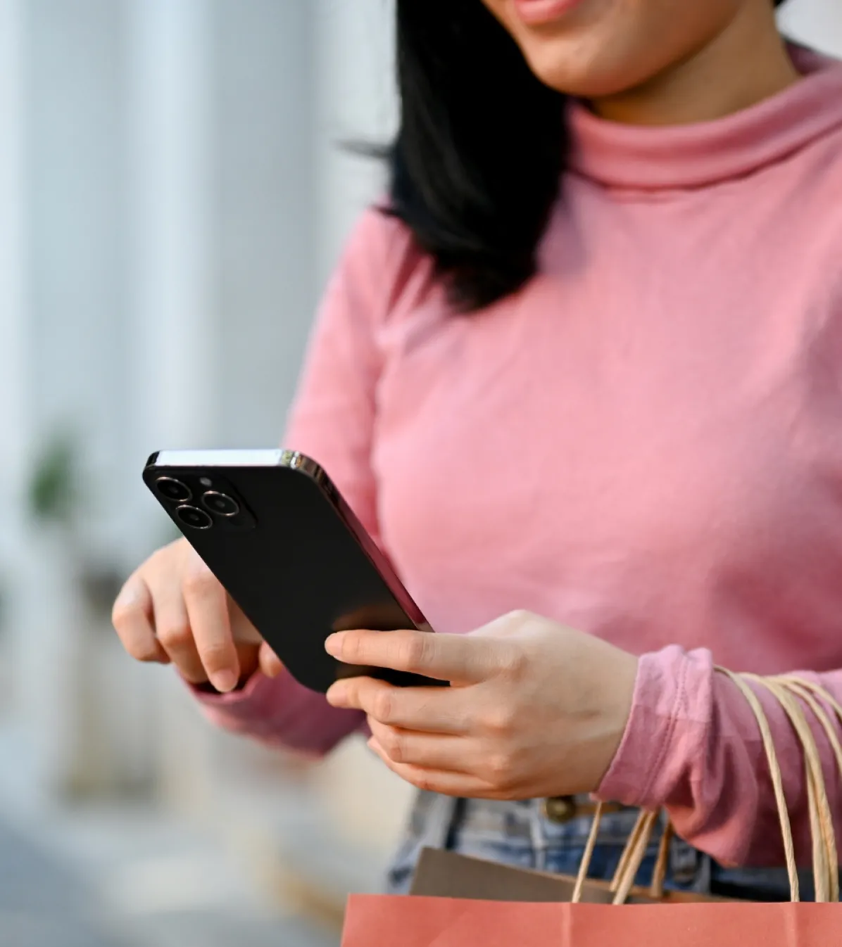 detail payment processing global woman carrying her shopping bags