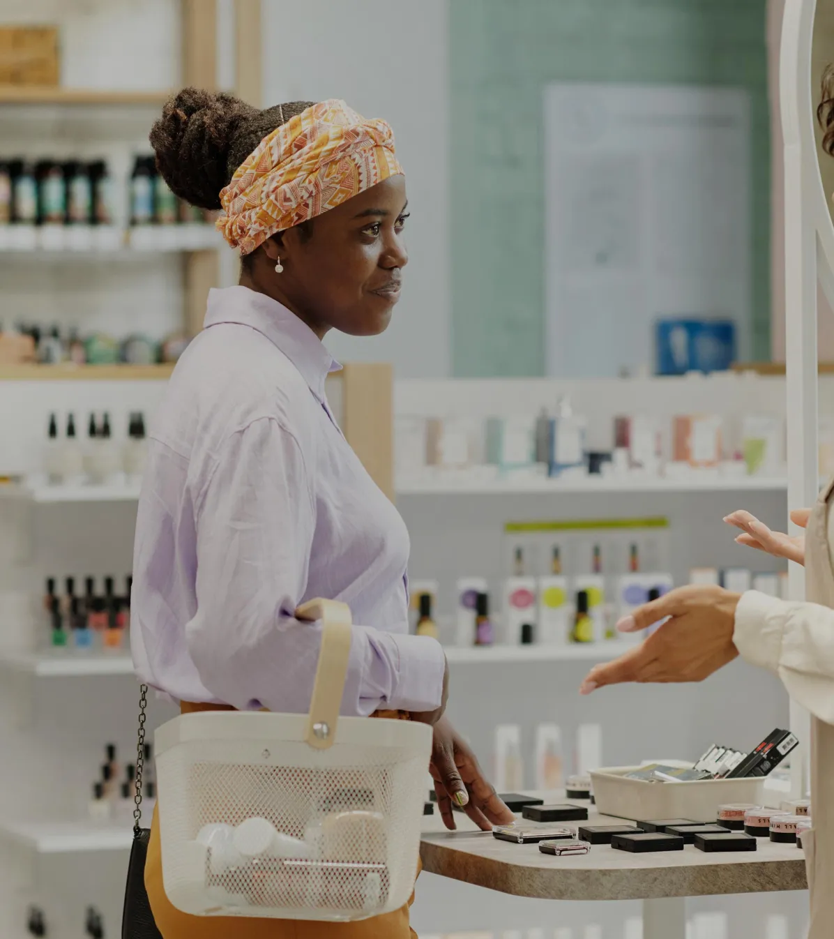 Cosmetics shop woman asking advice