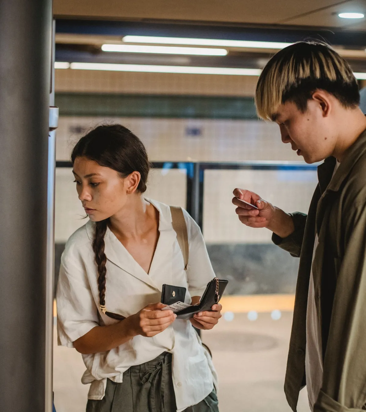 people couple buying tickets