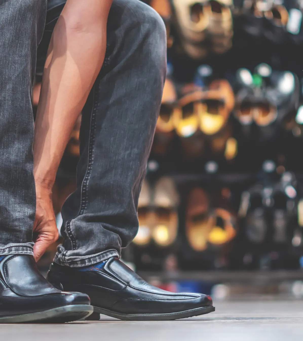 young man trying on dress shoes