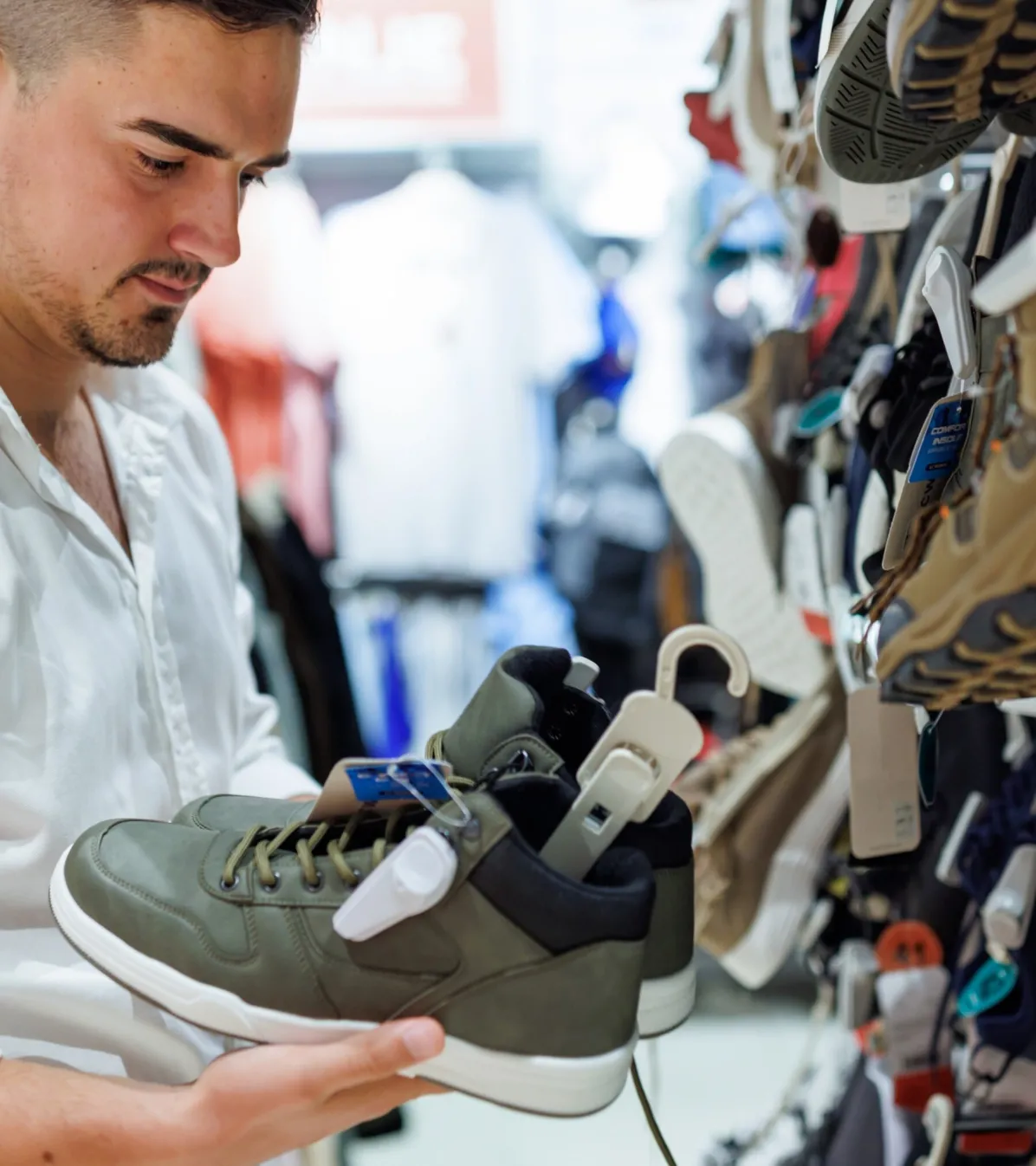 Young man shopping for athletic shoes