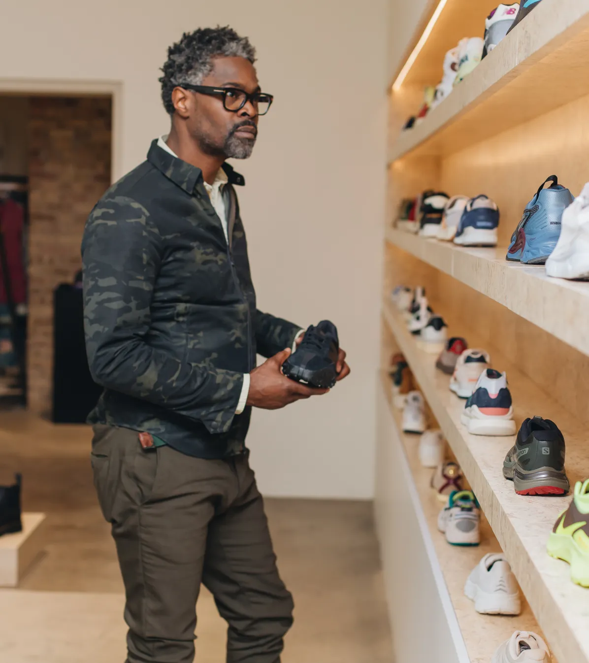 Man shopping for shoes in store