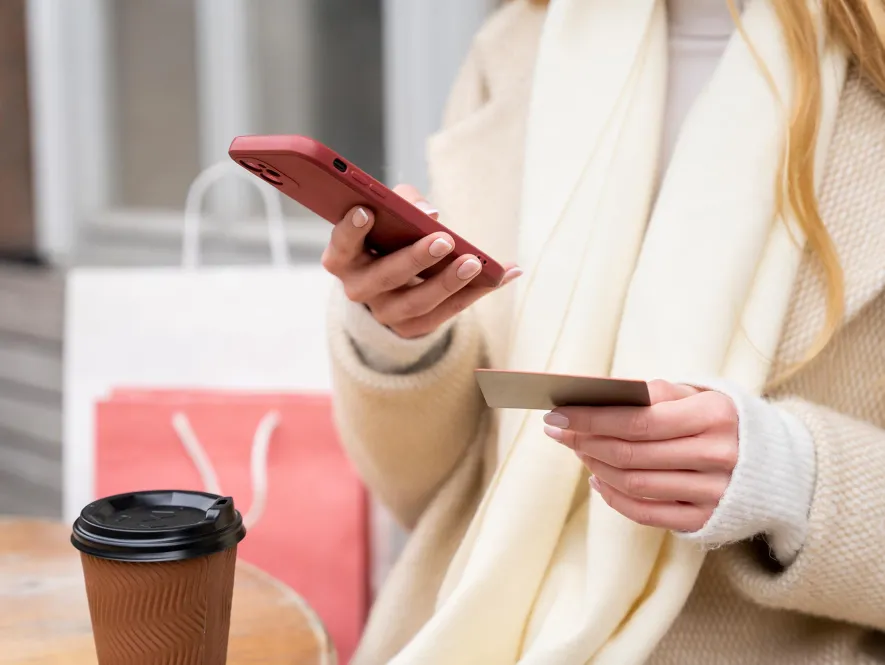close up woman making mobile payment