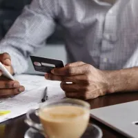 detail omnichanel solutions close up shot man hands holding mobile credit card