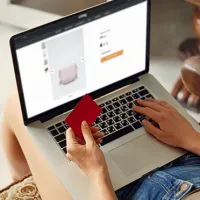 Young lady completing checkout payment