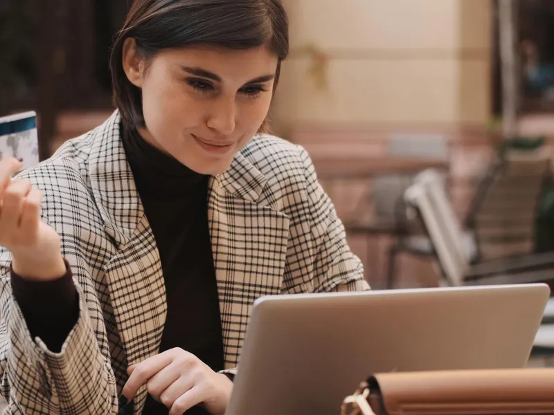 Woman paying online at terrace