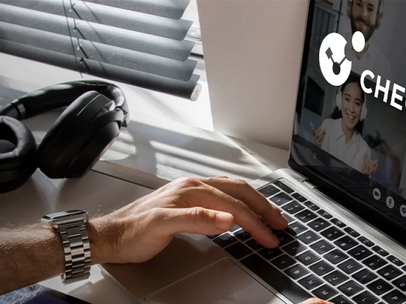 man using laptop with Check Point company logo on screen