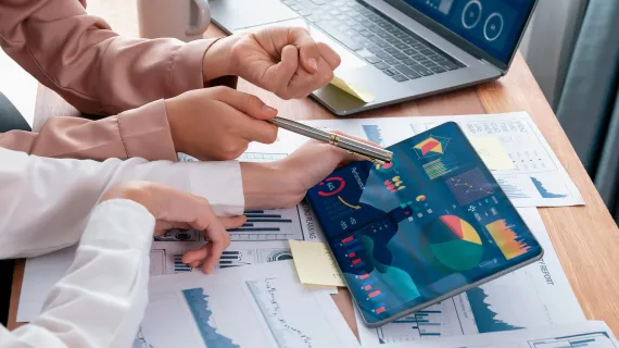 Colleagues analyzing business charts