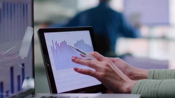 detail redirect checkout close up financial analyst study graphs charts laptop digital tablet