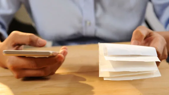 detail virtual terminal closeup person calculating paying bills