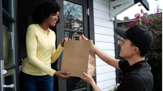 people convenience retail condelivery person getting parcel