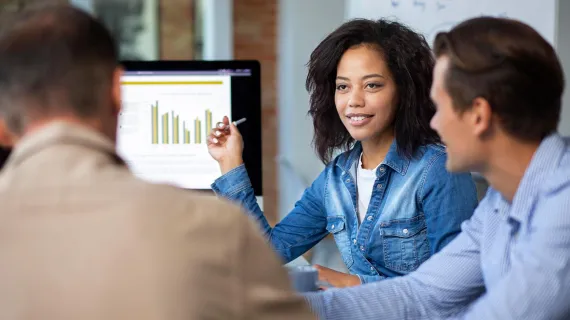 Confident young woman in meeting