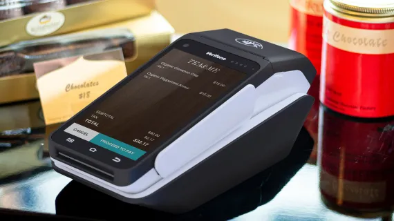 T650p portable payment device on candy counter