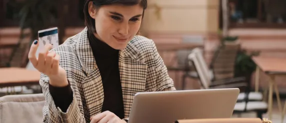 Woman paying online at terrace